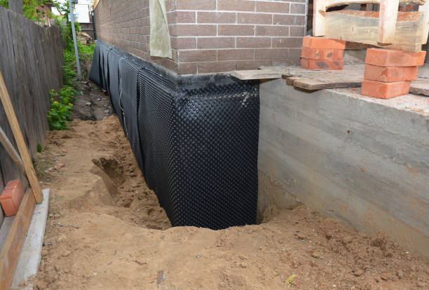 Happy homeowners after waterproofing job in Stilesville